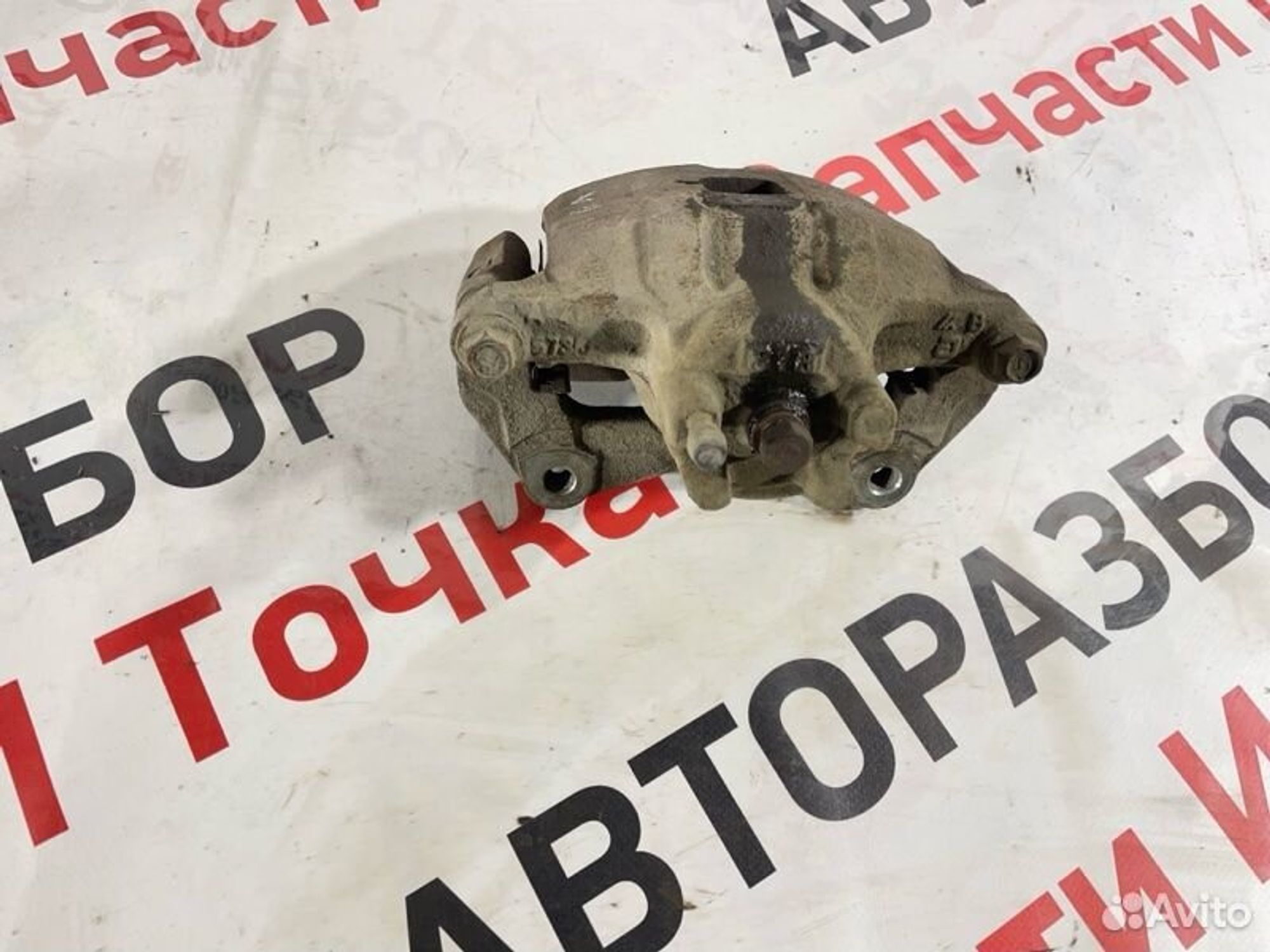 Суппорт тормозной передний левый Mitsubishi Lancer